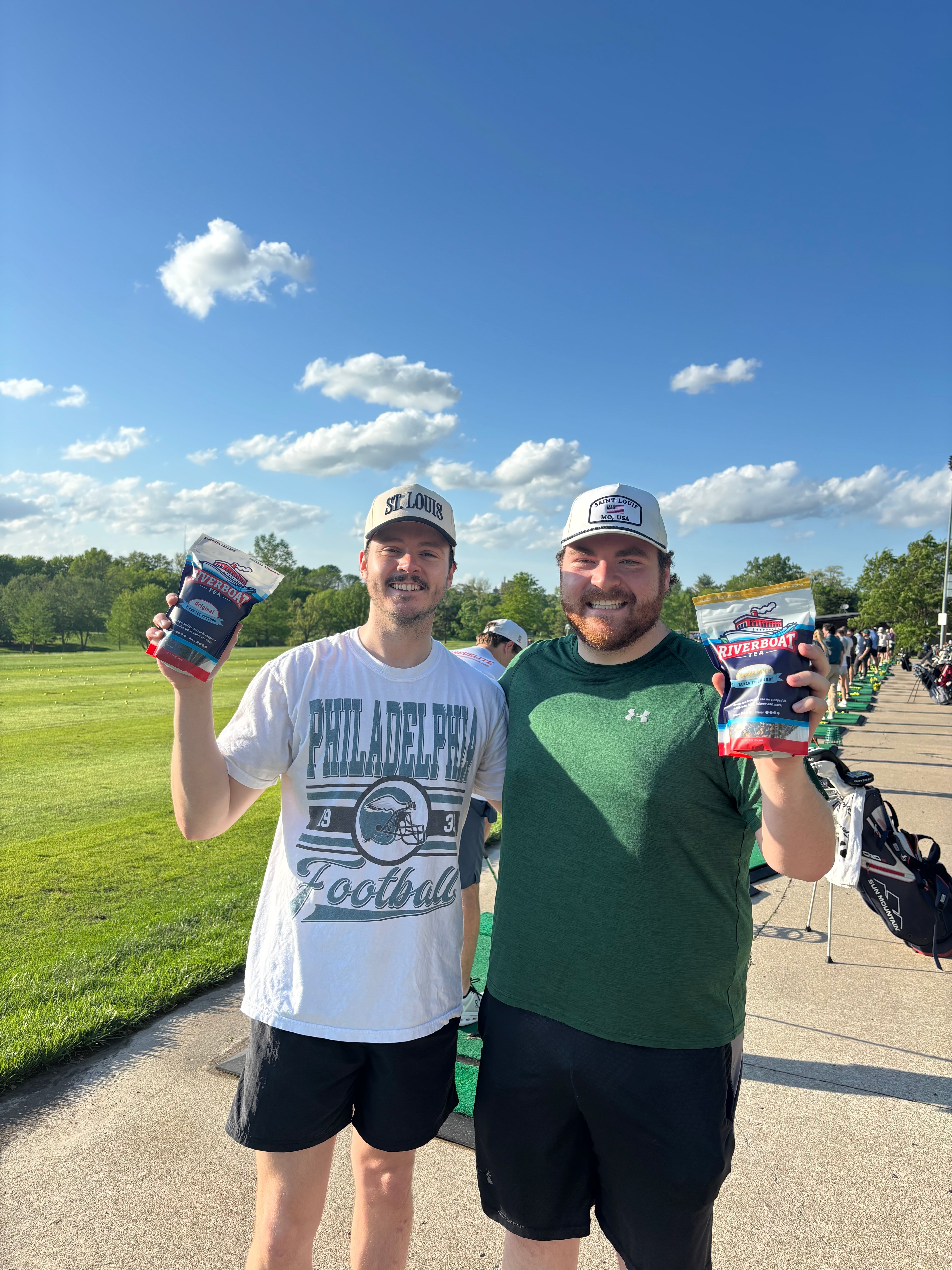 People Holding Riverboat Tea at Driving Range