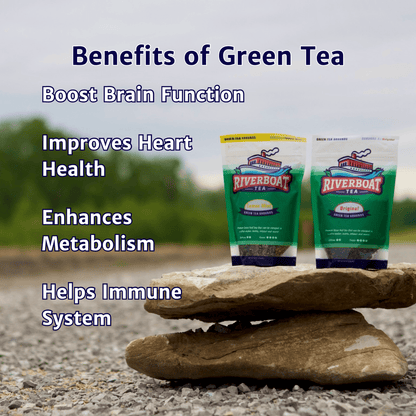 Two packages of Riverboat Green Tea on a rock with text about the benefits of green tea.