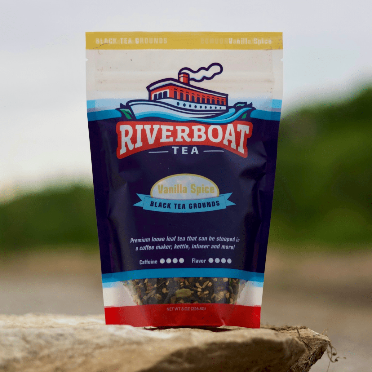 Riverboat Tea package with vanilla spice flavor on a blurred natural background