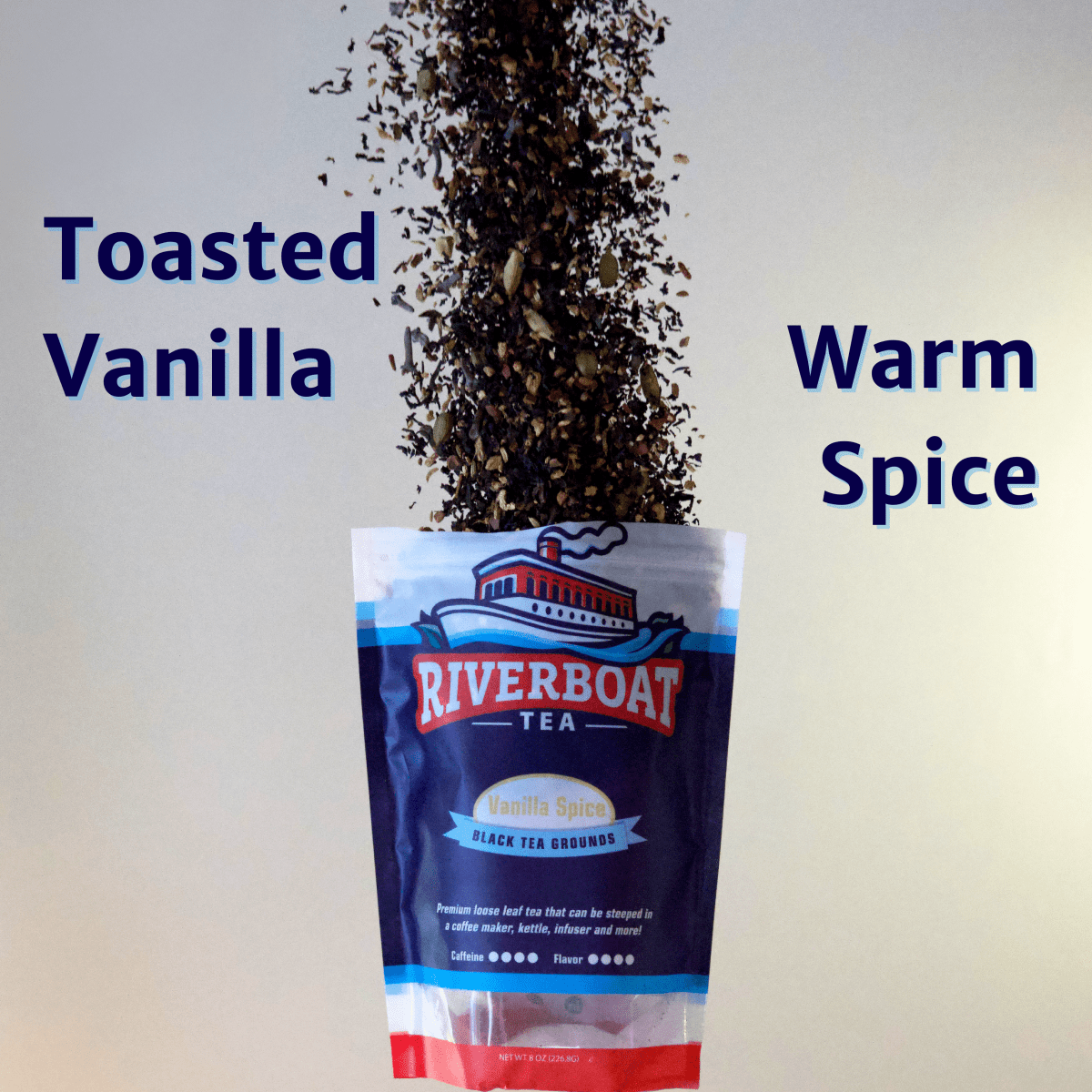 Riverboat Tea package with tea spilling out labeled 'Toasted Vanilla' and 'Warm Spice' on a light gray background.