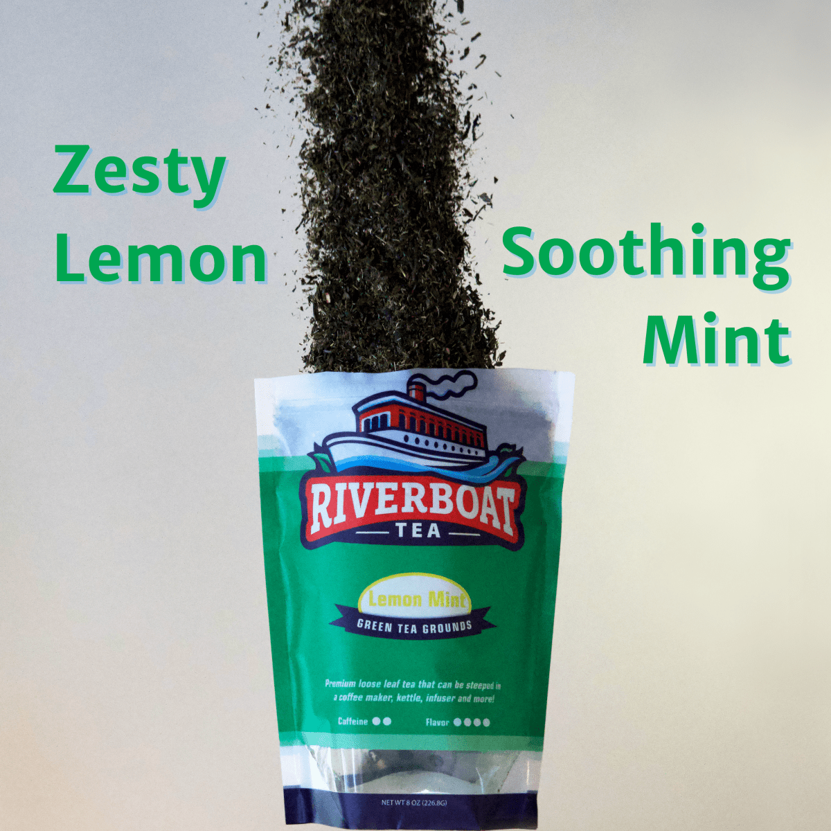 Riverboat Tea package with tea leaves spilling out, labeled 'Zesty Lemon' and 'Soothing Mint'.
