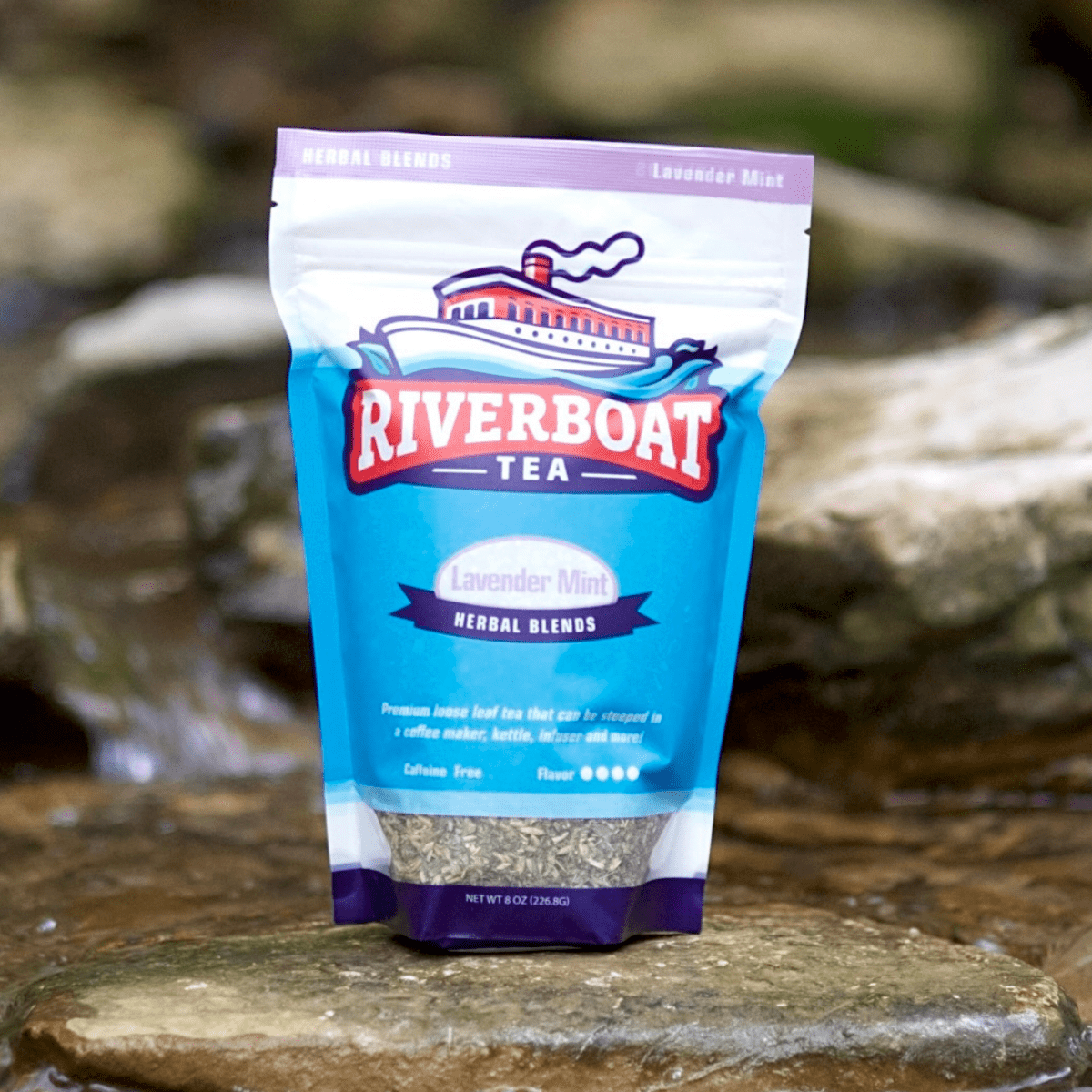 Riverboat Tea package on a stone surface with a natural background