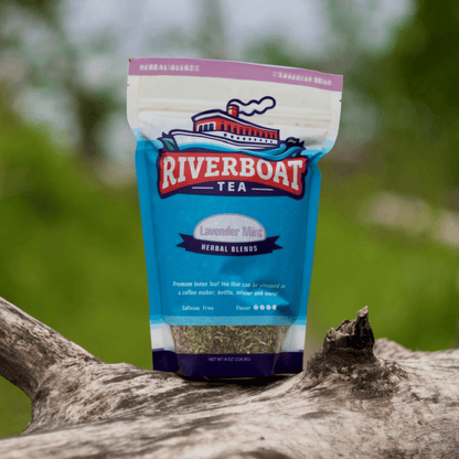 Riverboat Tea package on a branch with a blurred natural background