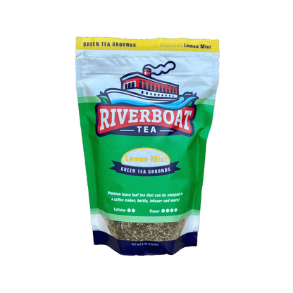 Green bag of Riverboat Tea Lemon Mint Green Tea Grounds on a white background