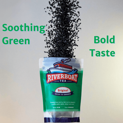 Riverboat Tea package with tea leaves spilling out, labeled 'Soothing Green' and 'Bold Taste'.